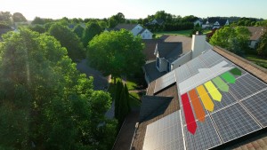 house with solar panels on roof showing a graph of energy savings