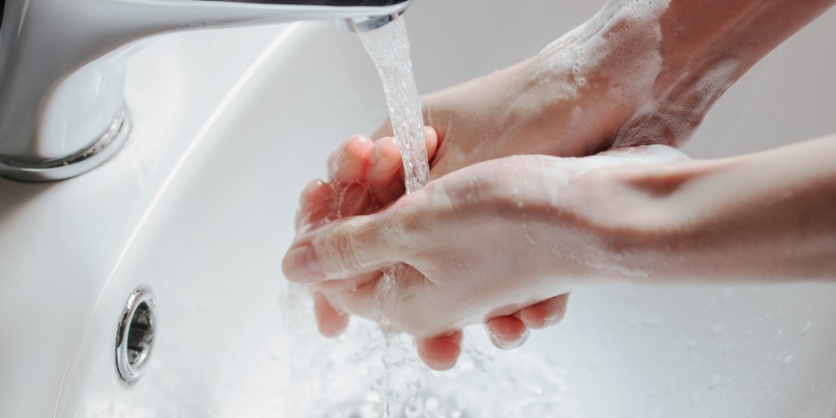 washing hands in hot water 